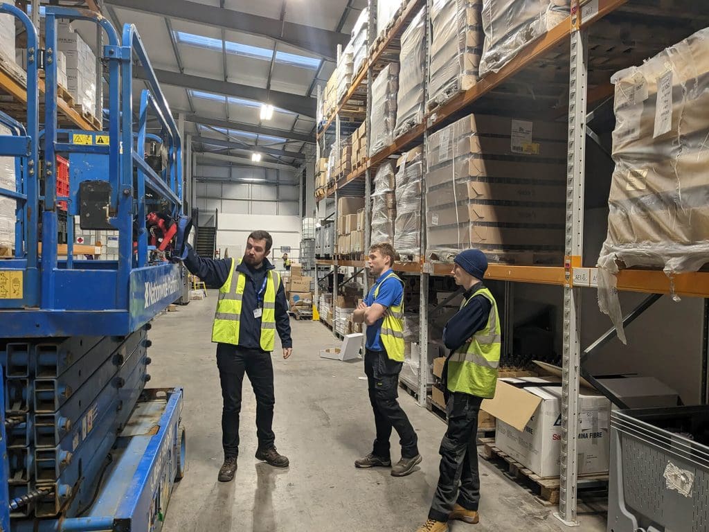 Our Fire & Security Apprentice learning on the job from our Health & Safety team