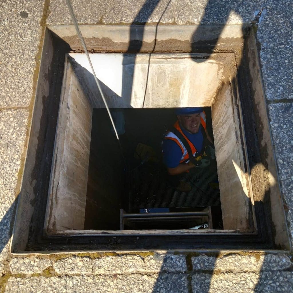 One of our Glasgow Electricians working underground in the Spring sunshine completing electrical upgrades