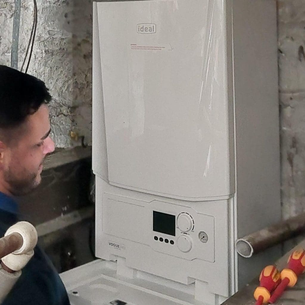 One of our Gas Safe engineers completing the installation of a new commercial boiler system for a pub in the East End of Glasgow