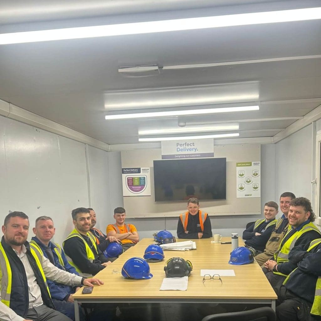 our electricians posing for a photo on site with our SHEQ Manager after he had delivered a Toolbox talk on site safety