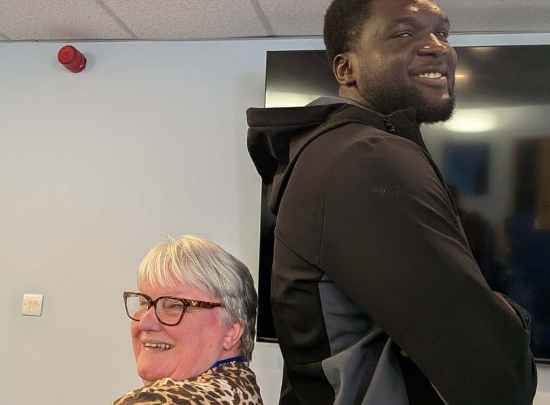 The size difference between a Glasgow Warriors Rugby Player and 'Wee Magz' in the Glasgow Office.