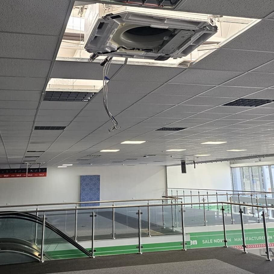 Carrying out repairs of an air conditioning system at Wren Kitchens in Paisley