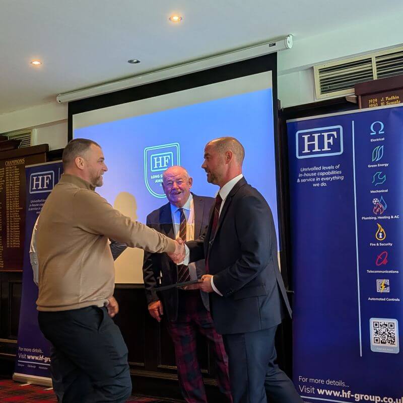 Mitch Fairney from HF Mechanical & Electrical receiving an award.