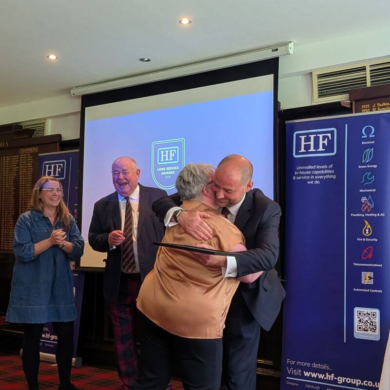 Margaret Cairney receiving her award for over 40 years of service to HF Group.