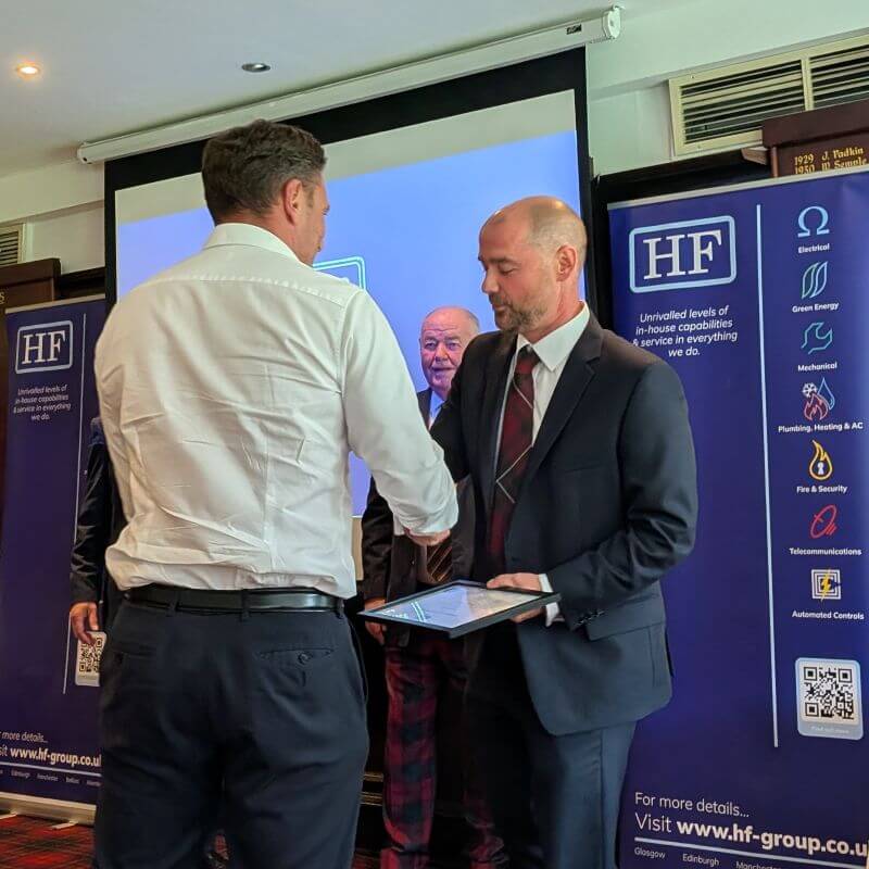 James Welsh receiving his certificate.