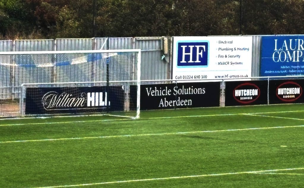 You won't miss the HF branding near the goal of Cove Rangers football ground.